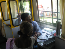 Doctor treating a patient inside the mobile medical unit